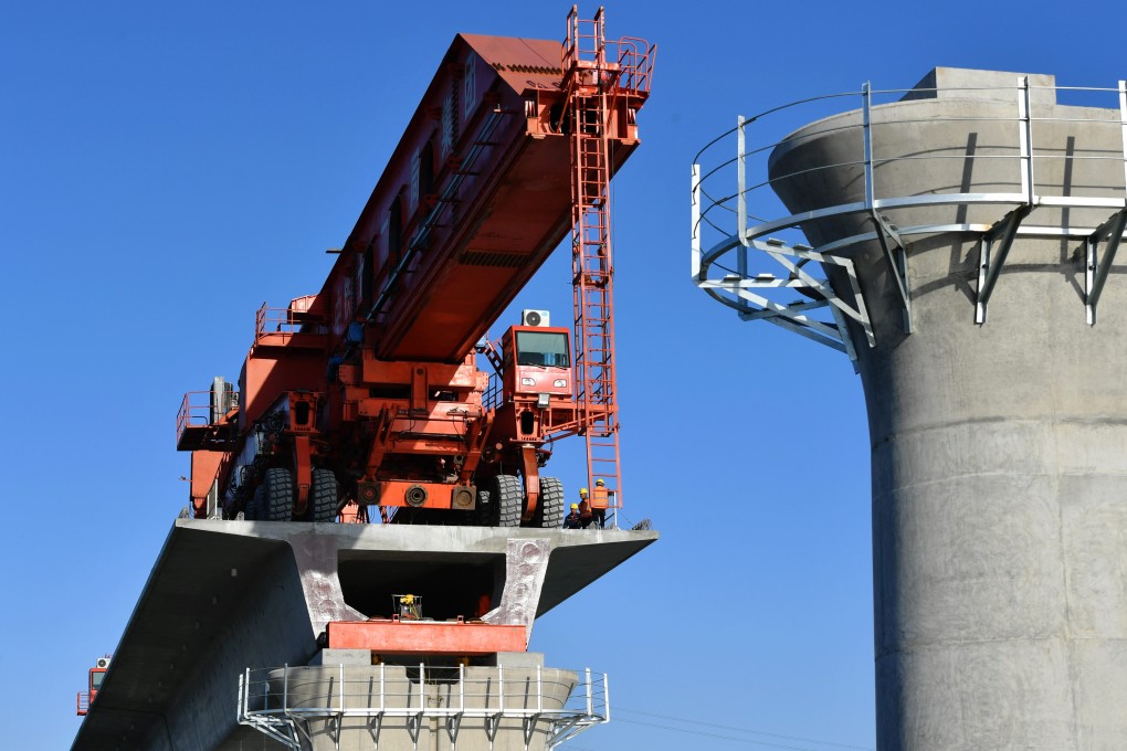 Construction crews work on the Meizhou Bay cross-sea bridge this month in China’s Fujian province. Photo: Xinhua