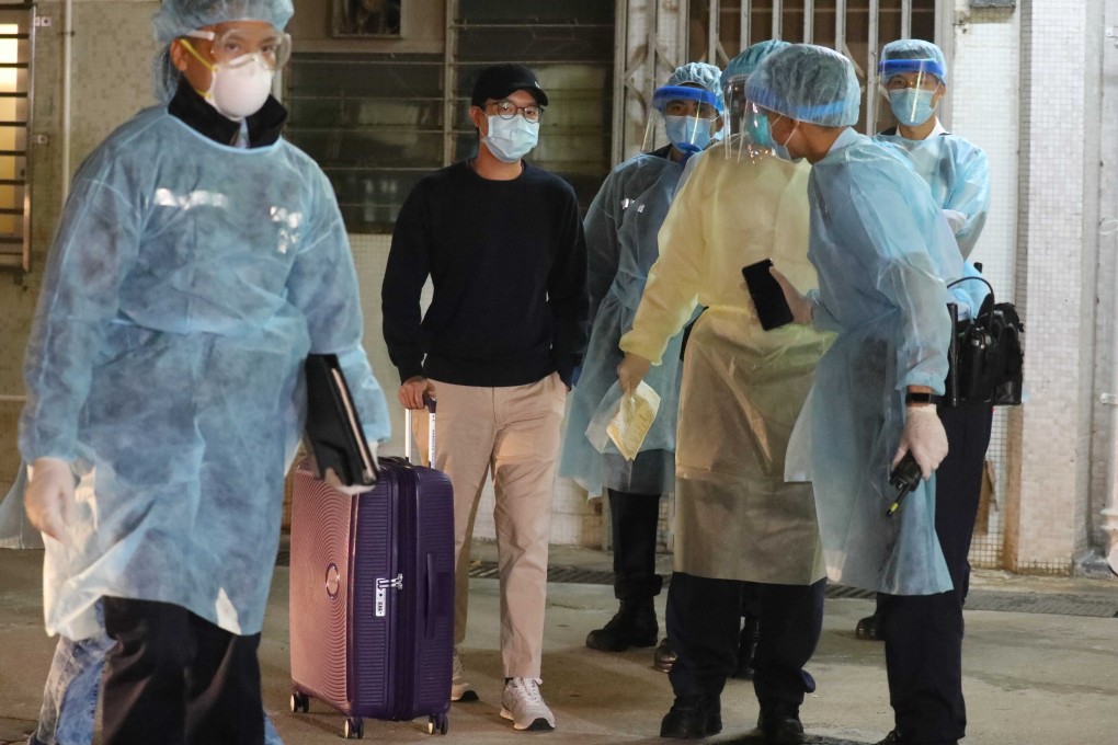 Residents leave Kwai Tung House, in Tung Tau Estate, after being evacuated following a coronavirus outbreak. Photo: Dickson Lee