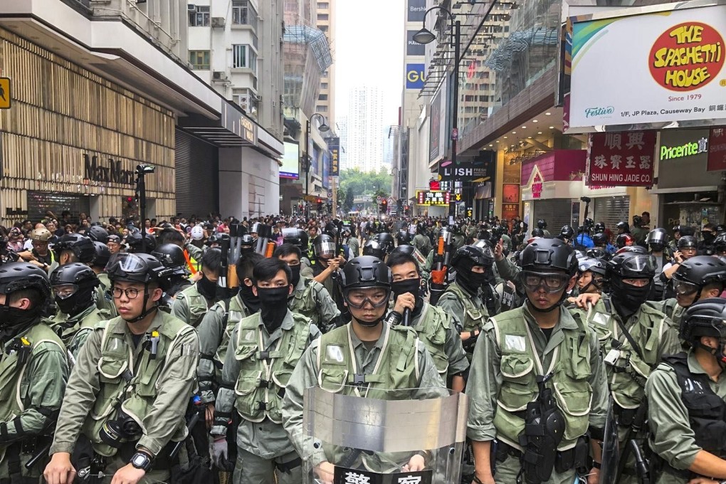 Riot police on standby in Causeway Bay as protesters gathered for a march last year. Photo: Sam Tsang
