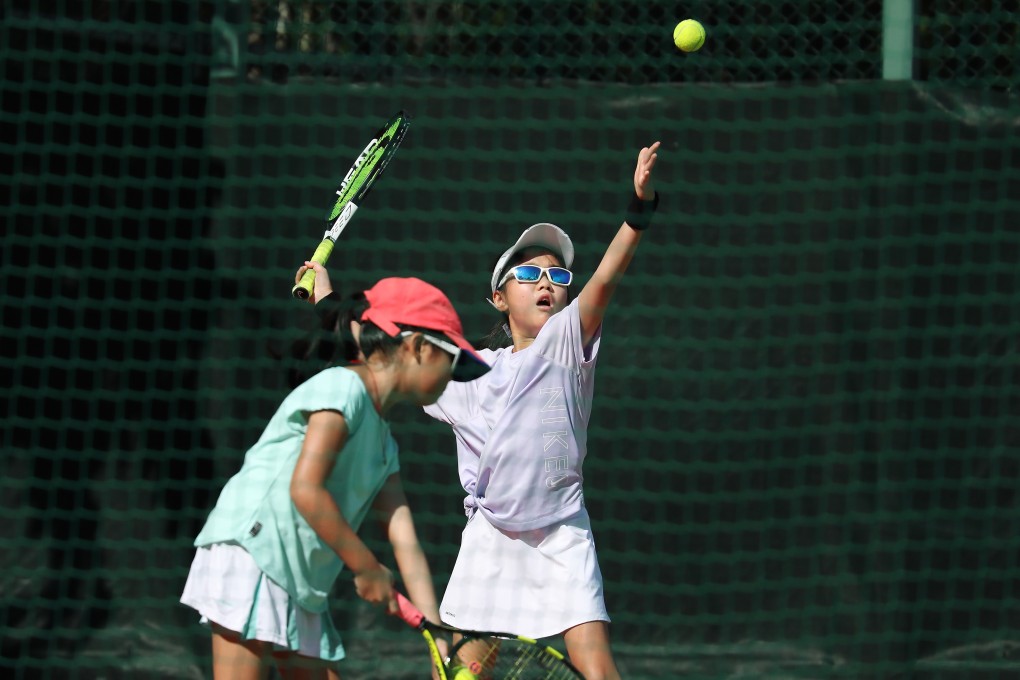 Children play tennis in Quarry Bay Park on September 12, after social-distancing rules were relaxed. The fourth wave of Covid-19 cases in Hong Kong has again led to the closure of outdoor sports venues from December 10 until further notice. Photo: Xiaomei Chen