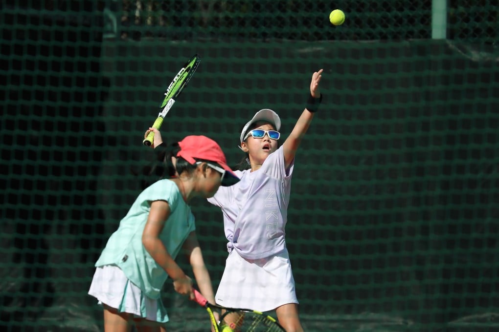 Children play tennis in Quarry Bay Park on September 12, after social-distancing rules were relaxed. The fourth wave of Covid-19 cases in Hong Kong has again led to the closure of outdoor sports venues from December 10 until further notice. Photo: Xiaomei Chen