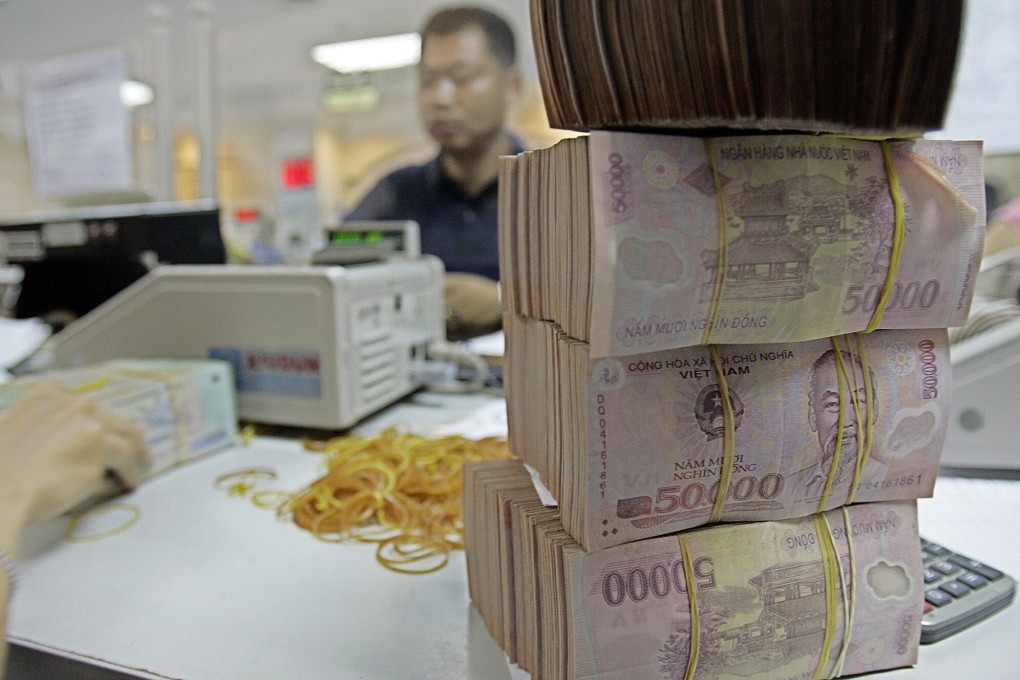Vietnamese dong notes are seen at a bank in Hanoi. The US Treasury Department has branded Vietnam and Switzerland as currency manipulators while putting China and nine other countries on a watch list. Photo: AP