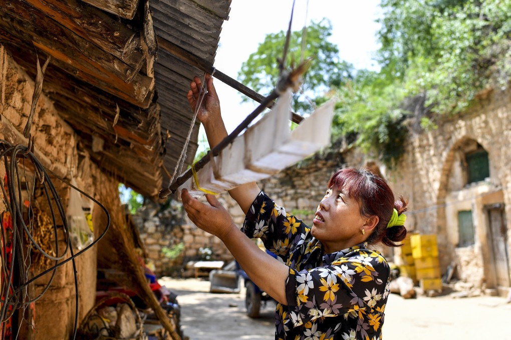 At least a dozen provinces in China are suffering from water scarcity. A villager in Yicheng county, Shanxi province, is seen here collecting rainwater. Photo: Xinhua