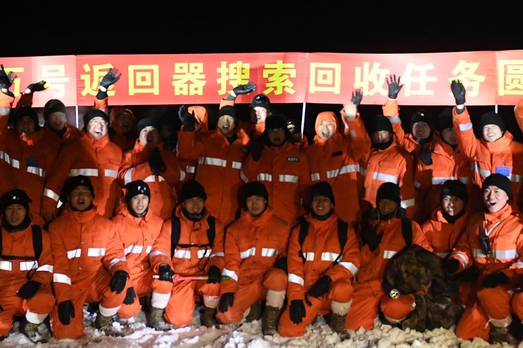 Jubilant ground staff at the Chang’e 5 return capsule’s landing site in north China’s Inner Mongolia region. Photo: Xinhua