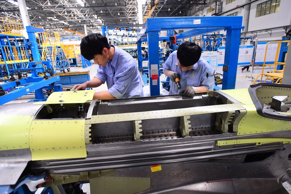 Workers assemble part of the engine for China's C919 passenger aircraft at a factory of Shenyang Aircraft Corporation in Shenyang, Liaoning province. Photo: Reuters