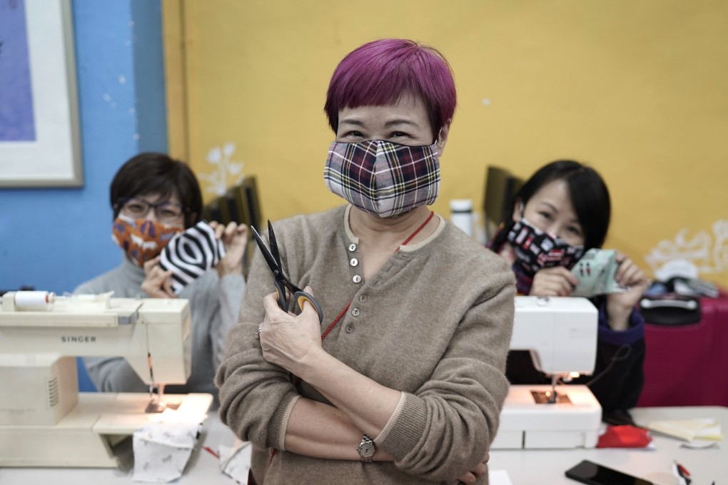 Members of a Hong Kong theatre group pose with handmade cotton masks in February, amid a mask shortage in the city. The volunteers sewed reusable protective masks for those unable to access or afford them. Photo: AP