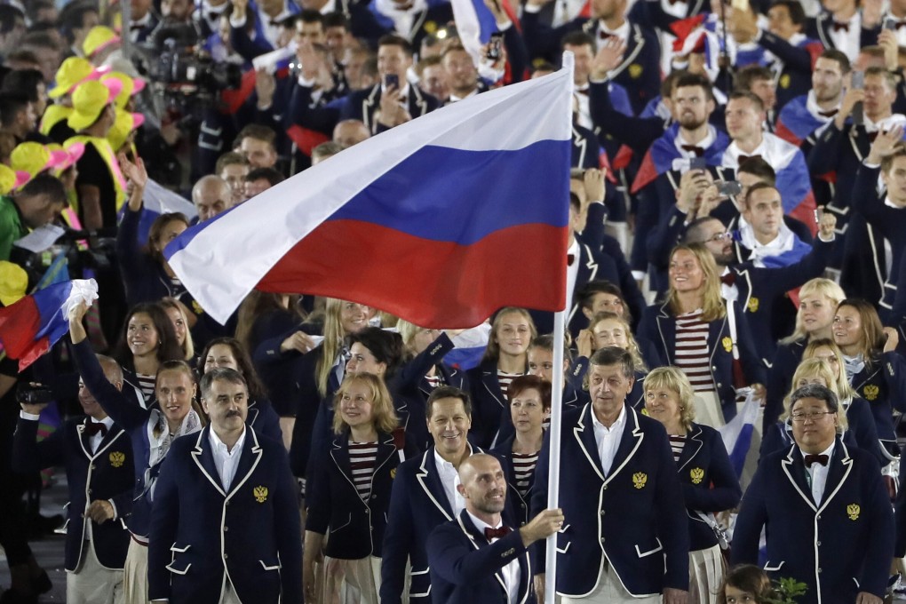 Sergei Tetiukhin carries the flag of Russia at the opening ceremony for the 2016 Summer Olympics in Rio. Russian athletes allowed to compete in Tokyo will be under a ‘neutral’ banner. Photo: AP