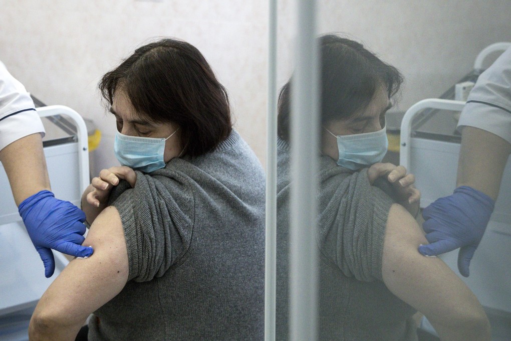 A medical worker finishes the procedure after administering a shot of Russia’s Sputnik V coronavirus vaccine in Moscow. Photo: AP
