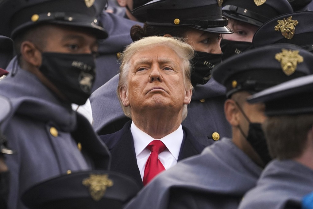 Surrounded by US Army cadets, President Donald Trump watches a football game at the United States Military Academy on December 12. Photo: AP