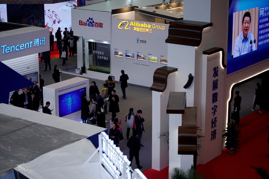 China's President Xi Jinping shown on a screen in front of logos of China's leading Internet companies. Photo: Reuters