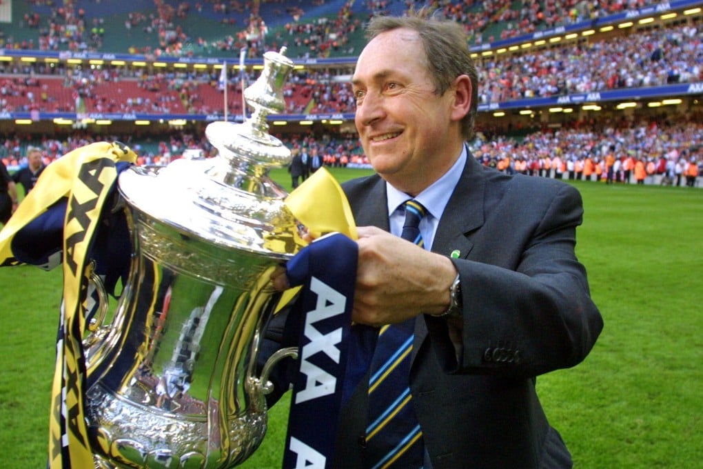 Gerard Houllier with the FA Cup trophy after Liverpool beat Arsenal at the Millennium Stadium in Cardiff in 2001. Photo: AFP