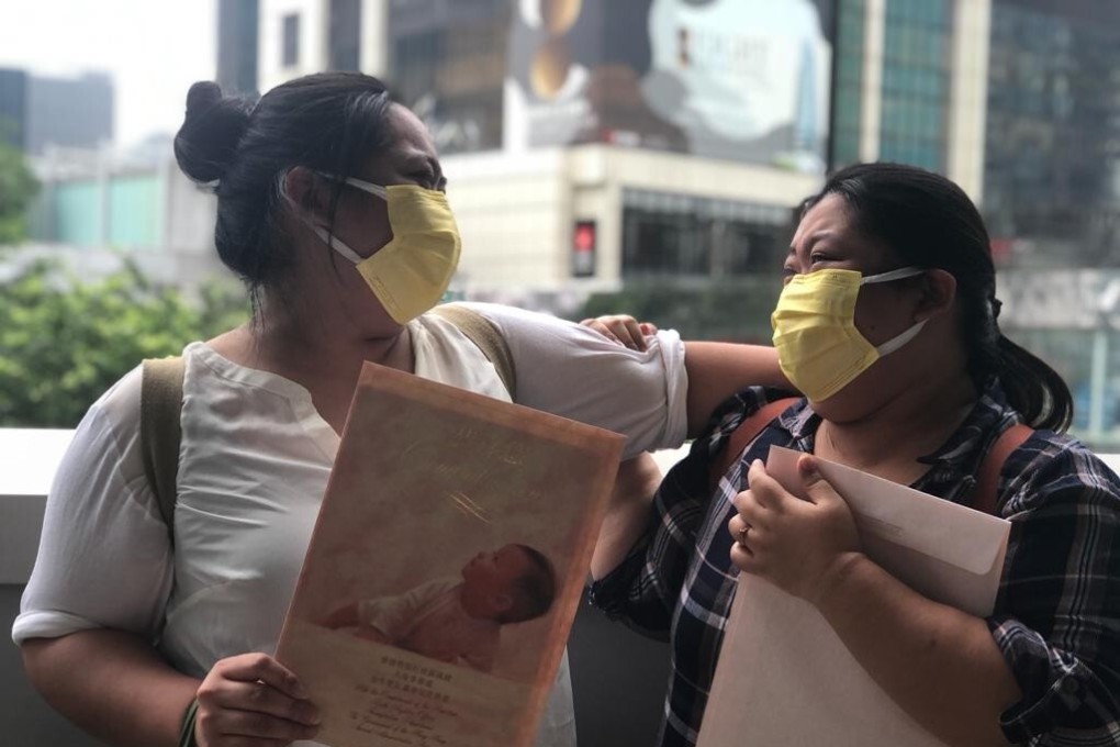 The two sisters, Kaye and Dawn, celebrate after receiving their birth certificates in late October. Photo: Handout