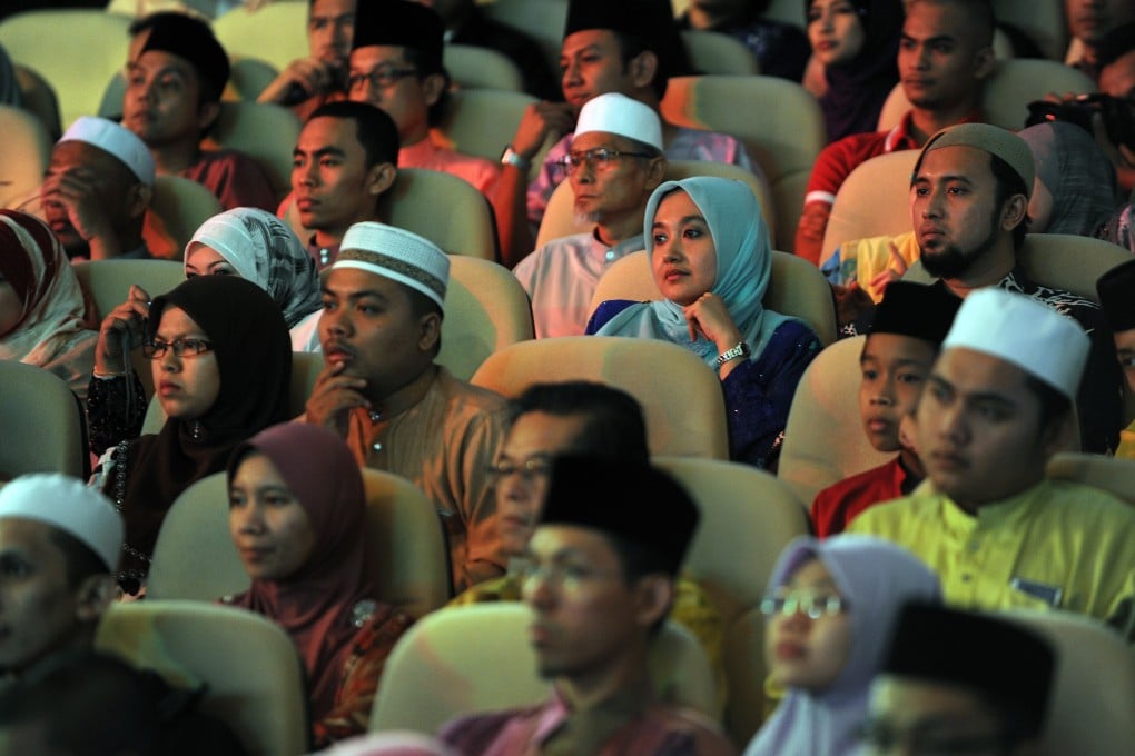 An audience watches a live performance of the Malaysian reality TV competition ‘Young Imam’ in Kuala Lumpur. Photo: AFP