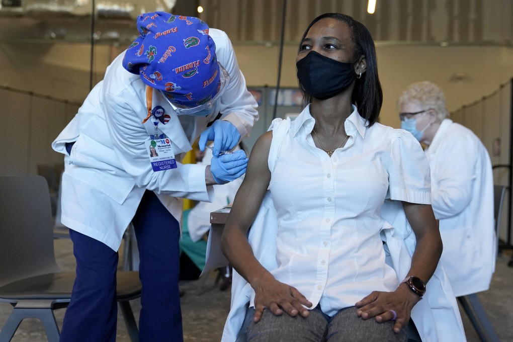 A Florida nurses receives the Pfizer-BioNTech vaccine after US regulators approved the use of the drug. Photo: AP