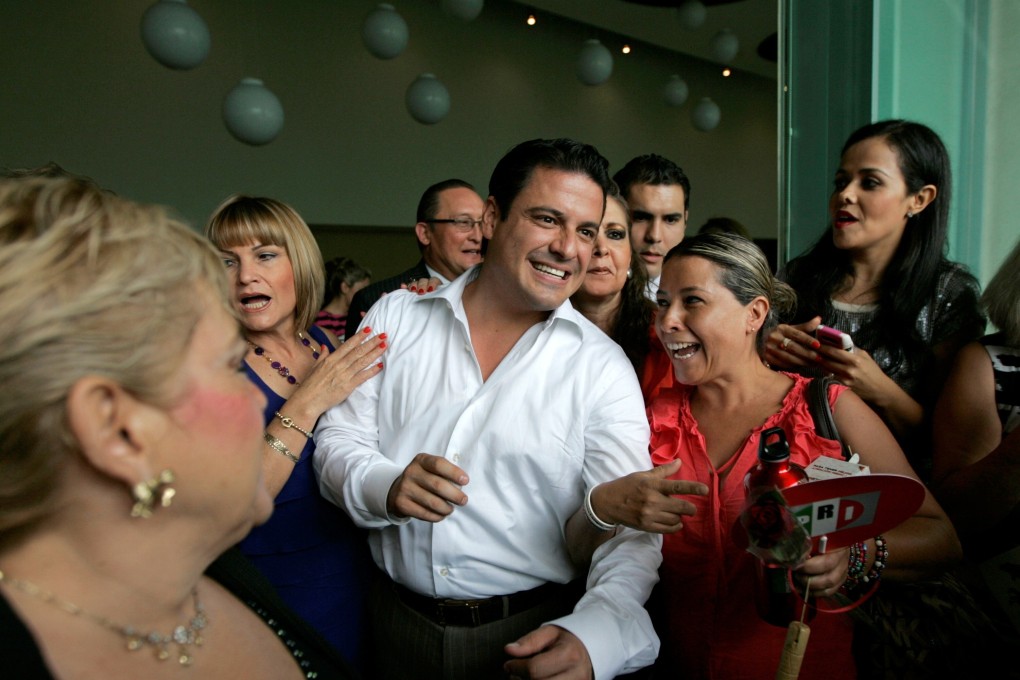 Aristoteles Sandoval is greeted by supporters during a 2012 meeting in Guadalajara, Mexico. File photo: Reuters