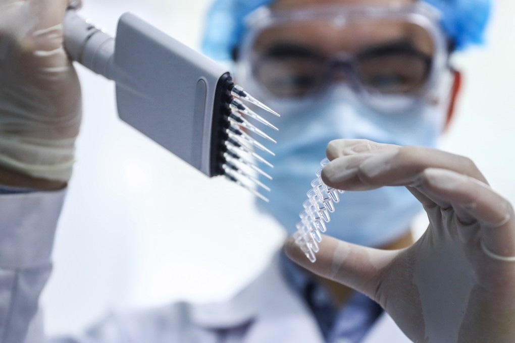 A member of staff tests samples of the Covid-19 inactivated vaccine at a Sinopharm vaccine production plant in Beijing, on April 11. Photo: Xinhua