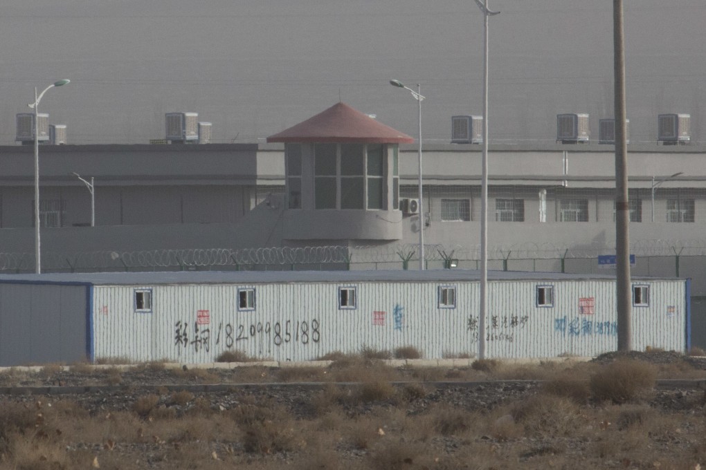 A guard tower and barbed wire fences are seen around a facility in the Kunshan Industrial Park in Artux, Xinjiang. China has denied allegations of human rights abuses. Photo: AP