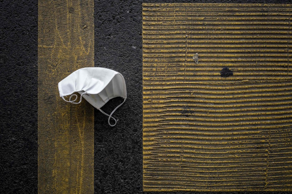 A discarded protective face mask lies on a parking place in November in Lausannem France. Photo: AFP