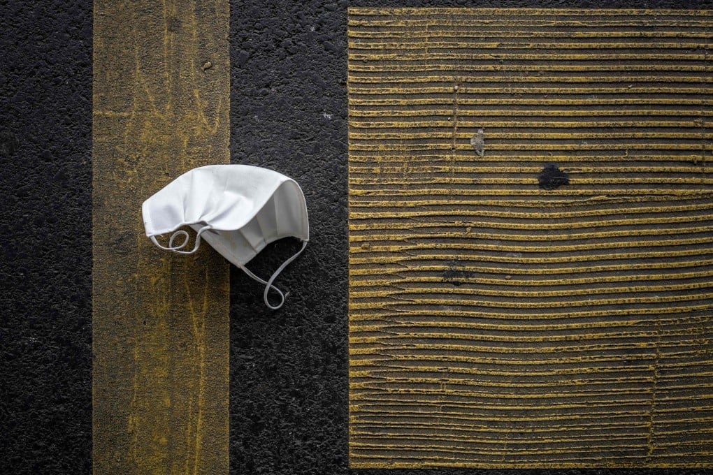 A discarded protective face mask lies on a parking place in November in Lausannem France. Photo: AFP