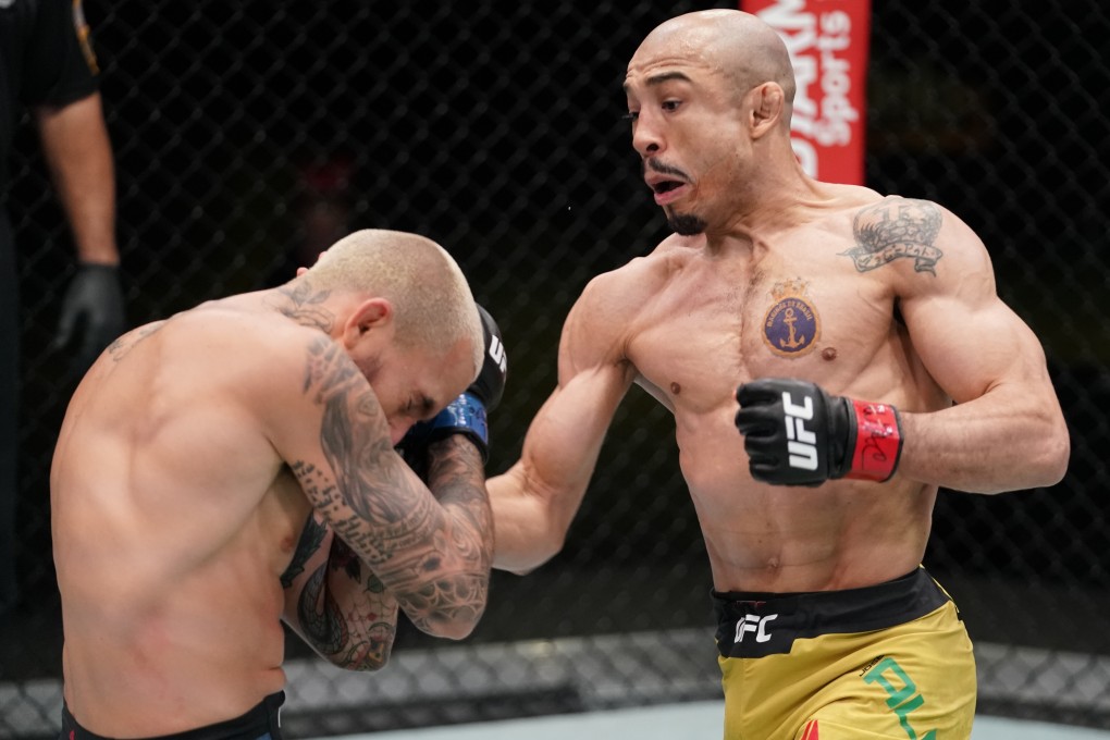 Jose Aldo punches Marlon Vera in their bantamweight fight during the UFC Fight Night event at UFC Apex on December 19, 2020 in Las Vegas, Nevada. Photos: Cooper Neill/Zuffa LLC