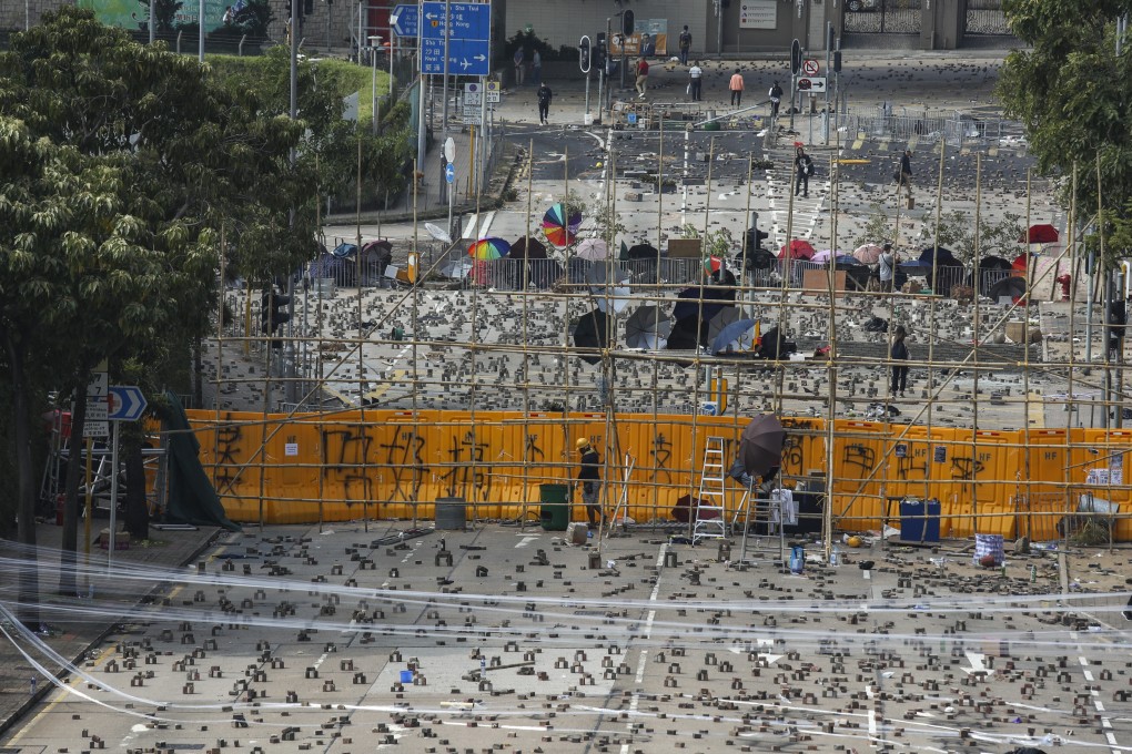 Anti-government protesters set up roadblocks outside Baptist University in Kowloon Tong last year. Photo: Xiaomei Chen