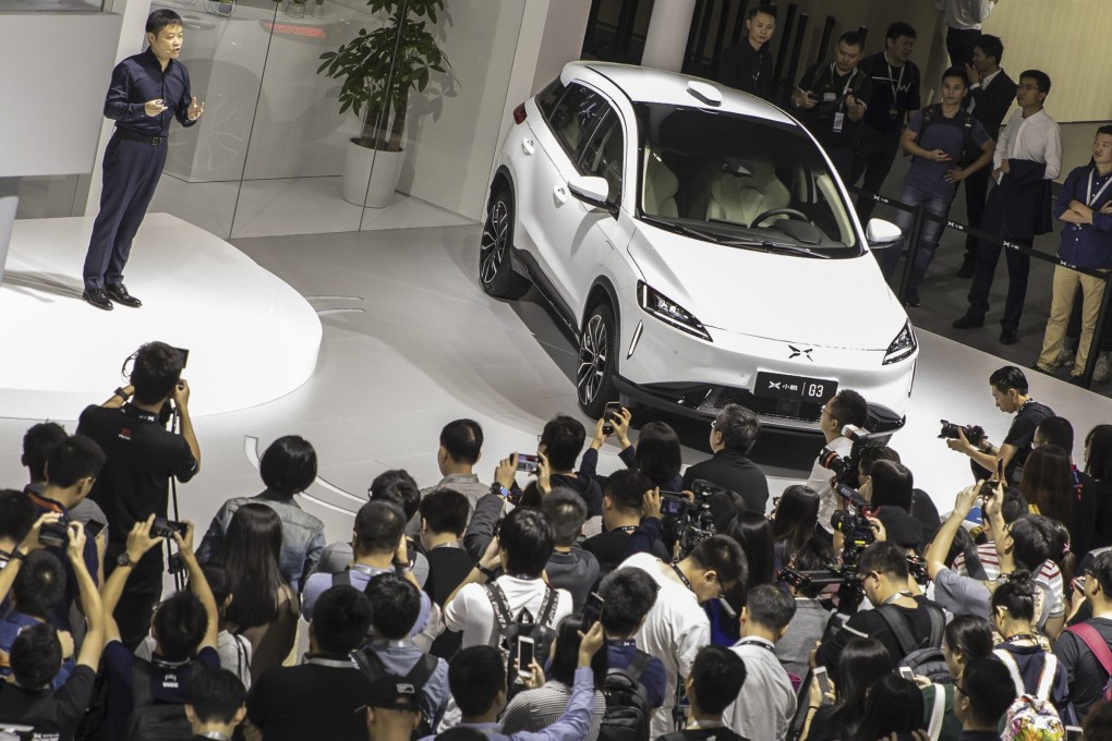 He Xiaopeng, chairman and co-founder of Xpeng Motors, speaks as he stands next to the company’s G3 electric SUV, at the Guangzhou International Automobile Exhibition, in Guangzhou, China, on November 16, 2018. Photo: Bloomberg