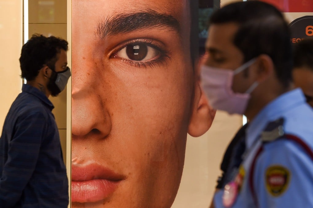 People walk through a shopping centre in Thane on the outskirts of Mumbai on December 18. India is in economic recession after two successive quarterly GDP contractions. Photo: AFP