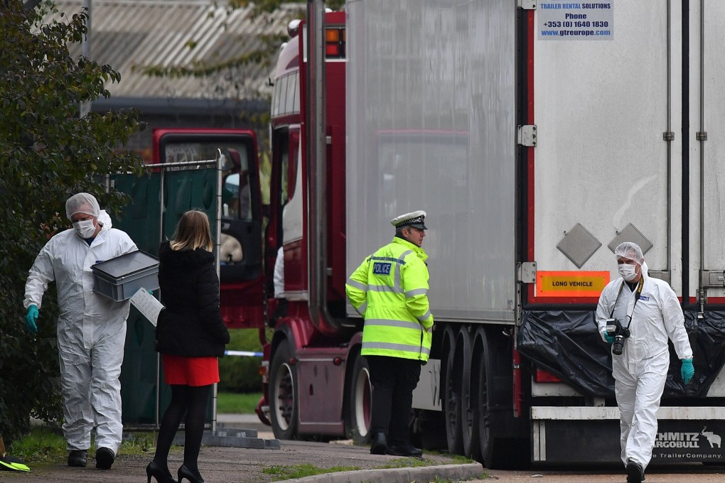 British forensics officers work on the truck, which was found to contain the bodies of 39 people, at an industrial estate east of London on October 23, 2019. Photo: AFP