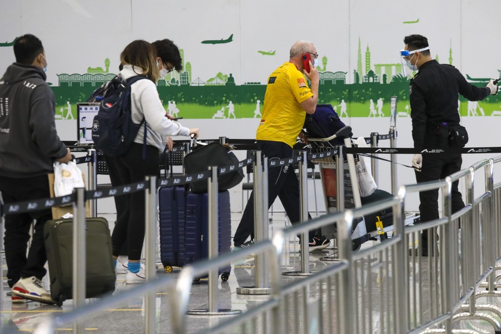 Passengers from London arrive at Hong Kong International Airport on Monday. Photo: K. Y. Cheng
