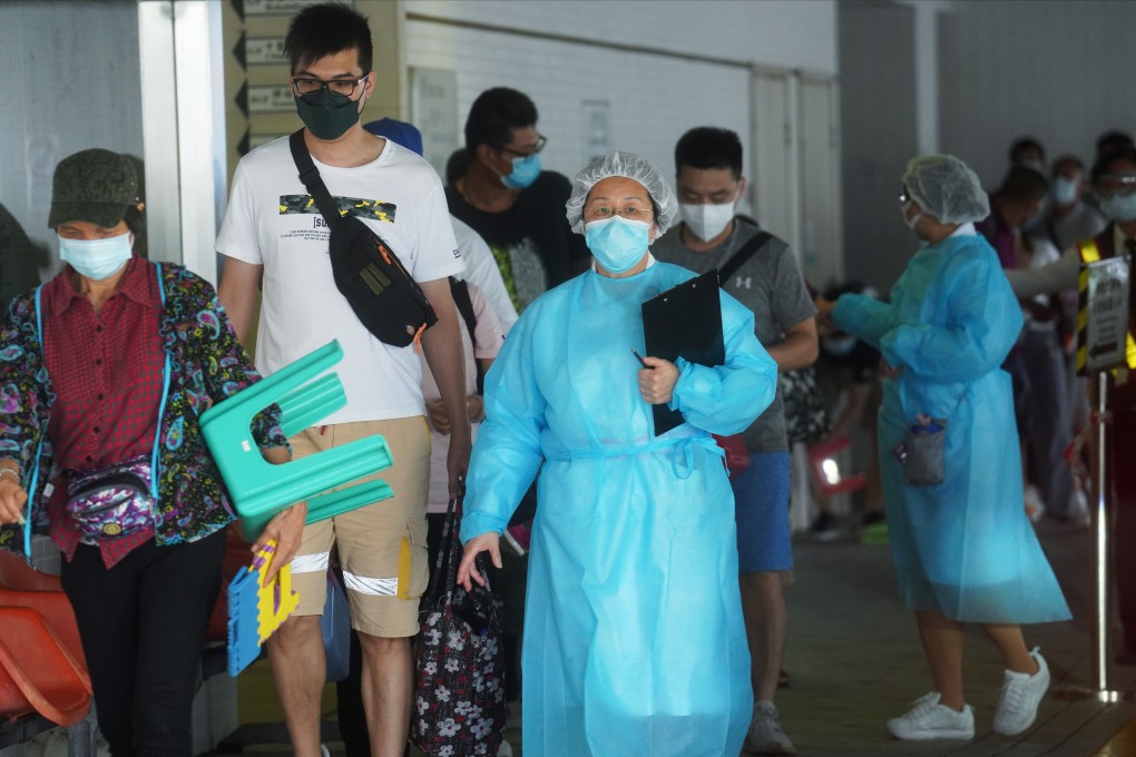 Medical staff at on duty at a Hong Kong hospital, as people queue to be tested during a Covid-19 outbreak in July. The number of city patients enrolled in the government’s Electronic Health Record Sharing System has reached 1.34 million. Photo: Winson Wong
