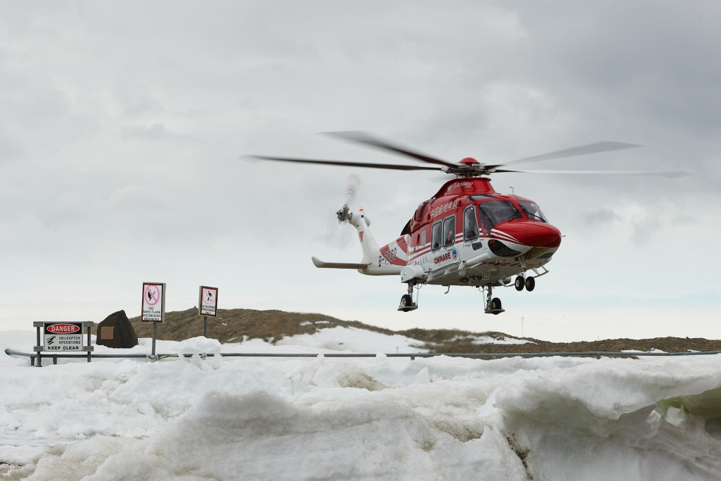 A Chinese helicopter lands at Davis research station as part of the medevac operation. Photo: Dan Dyer