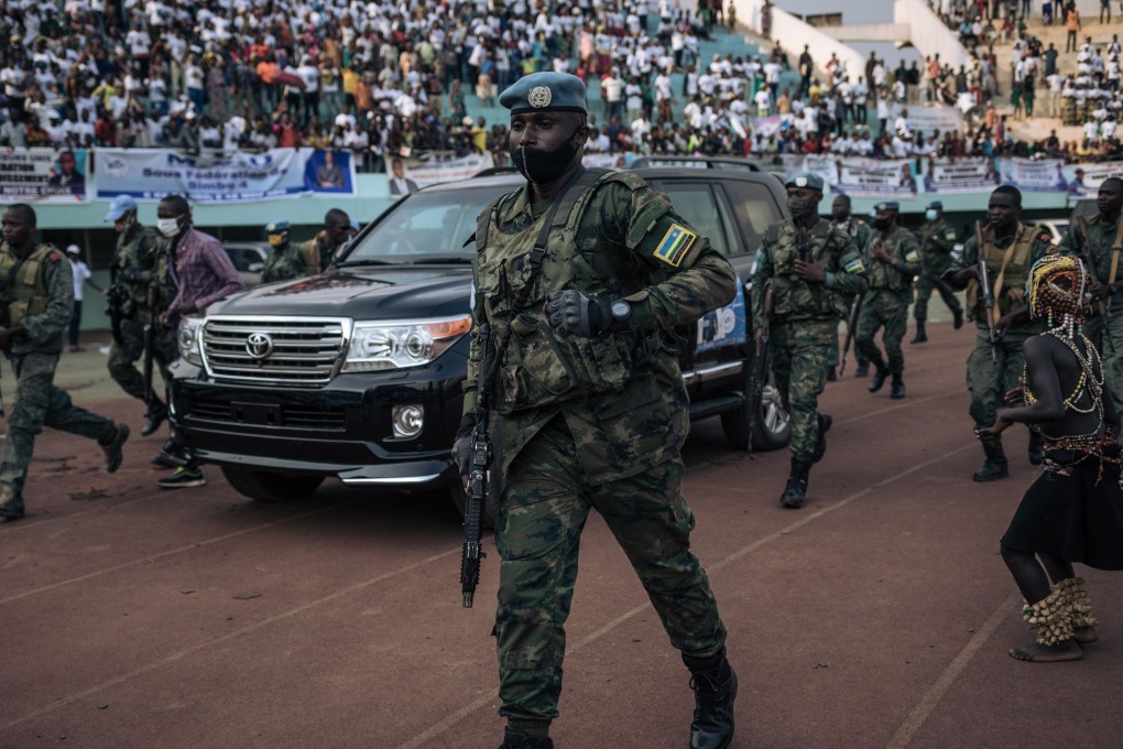 Central African Republic’s president is escorted by the presidential guard, Russian mercenaries, and Rwandan UN peacekeepers, in Bangui. Photo:
