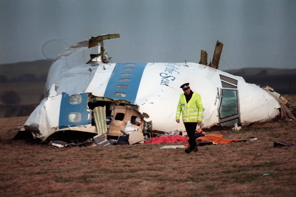 A policeman walks away from the damaged cockpit of the Pan Am plane that exploded and crashed over Lockerbie, Scotland in December 1988 with 259 people on board. Photo: AFP