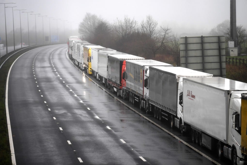 Lorries headed to the Port of Dover, queued along the M20 motorway in Kent, Britain. Photo: EPA