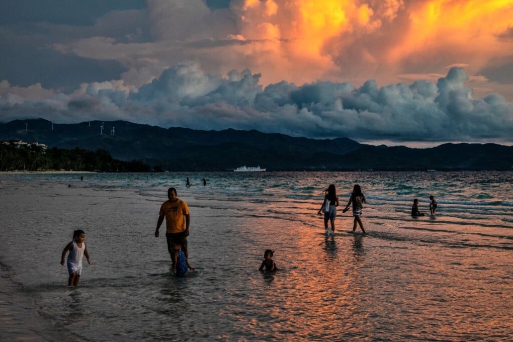 Domestic tourists at White Beach in Boracay, the Philippines in October. The popular tourist destination has been devastated by the Covid-19 pandemic, and domestic visitor numbers are too low to sustain many businesses. Photo: Getty Images
