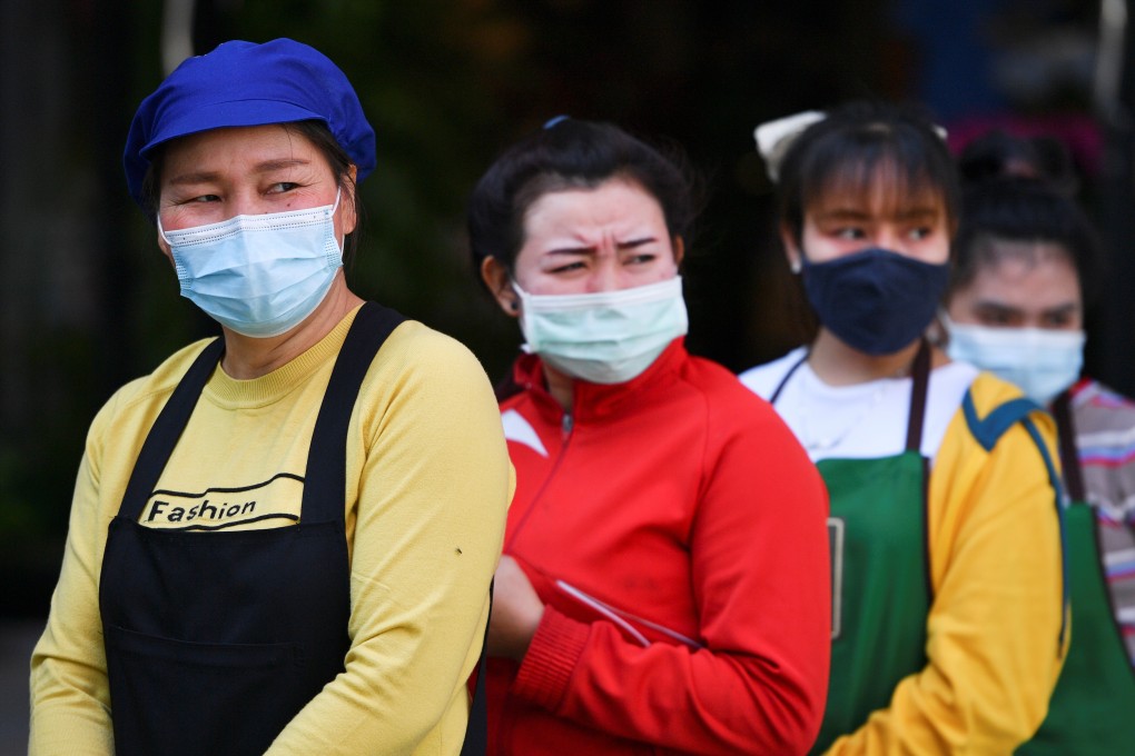Migrant workers queue to meet Covid-19 officials in Bangkok on December 22, 2020. Photo: Reuters