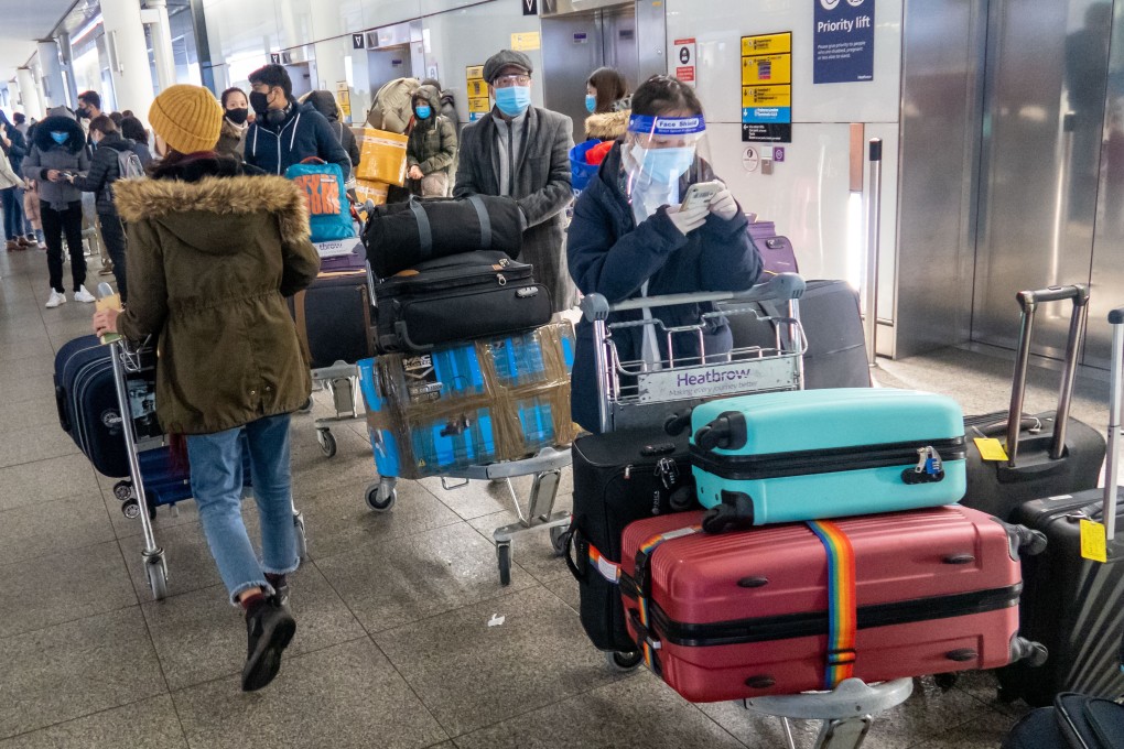 Passengers queue for the departure area at Heathrow airport in London, a day after a number of countries started to ban flights from Britain. Photo: Xinhua