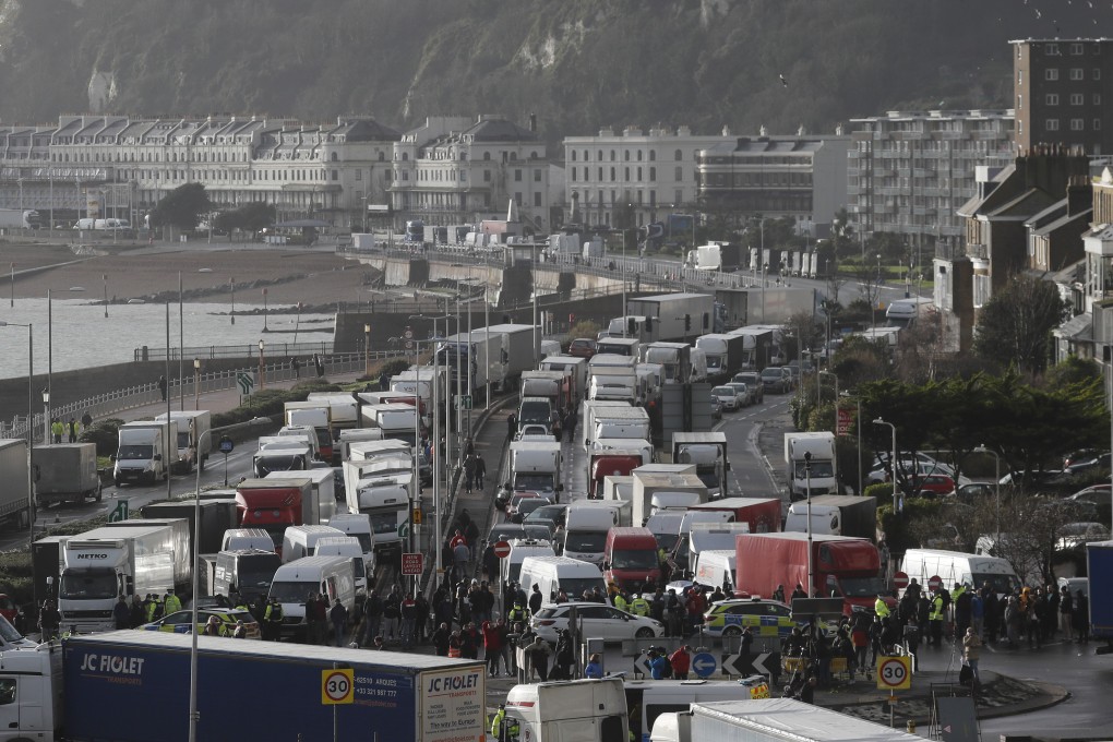 Vehicles wait at the entrance to the port of Dover in Britain. Photo: AP