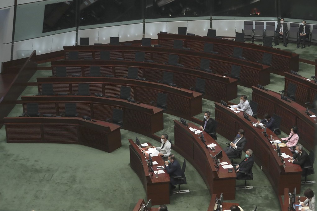 Hong Kong lawmakers listen as Hong Kong’s 2020 policy address is delivered in the Legislative Council chamber on November 25. The empty seats on the left are where the pan-democratic camp used to be seated. Photo: Dickson Lee