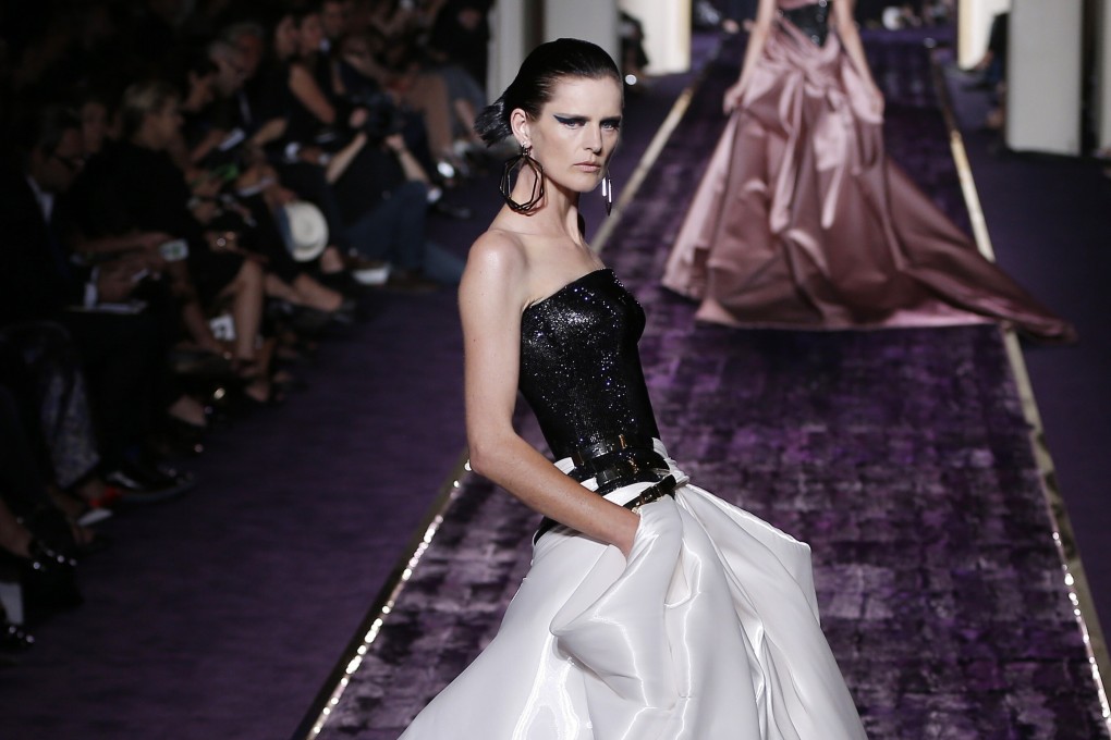 British model Stella Tennant presents a creation from the Haute Couture Fall-Winter 2014/15 collection by Italian designer Donatella Versace. File photo: EPA