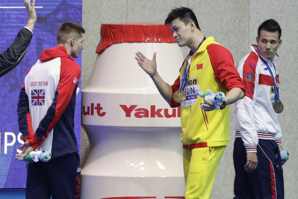 China's Sun Yang flares up at Britain’s Duncan Scott, who refused to shake hands during the medal ceremony at the 2019 world championships. Photo: AP