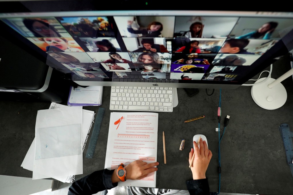A student takes classes online with his companions using the Zoom app at home during the coronavirus outbreak in El Masnou, north of Barcelona, Spain on April 2, 2020. Photo: Reuters