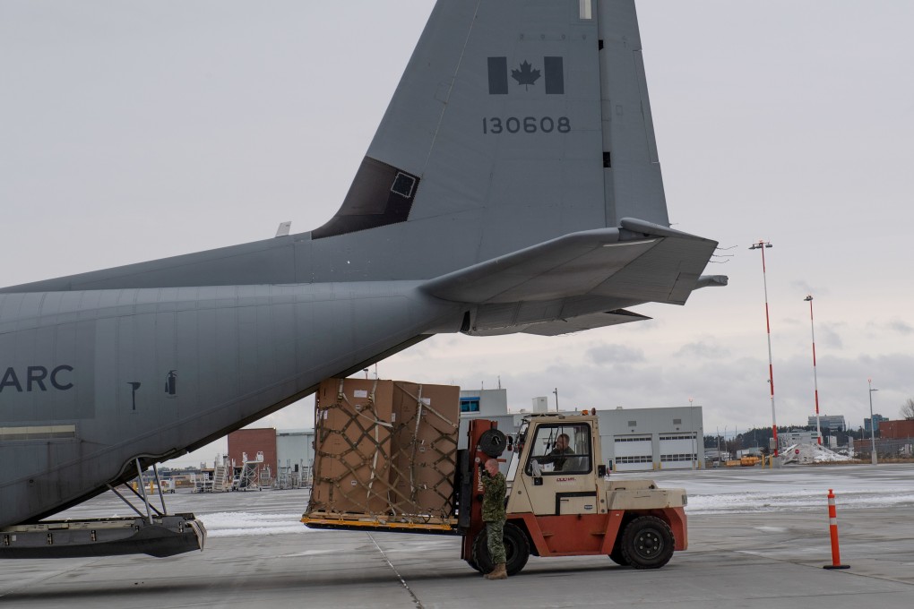 Special freezers for coronavirus vaccines are loaded onto a transport aircraft near the Ottawa airport in the eastern Canadian province of Ontario. Photo: Reuters