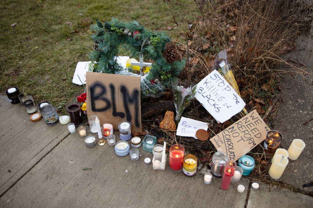 Candles burn outside the home where Andre Hill was killed in Columbus, Ohio. Photo: Reuters