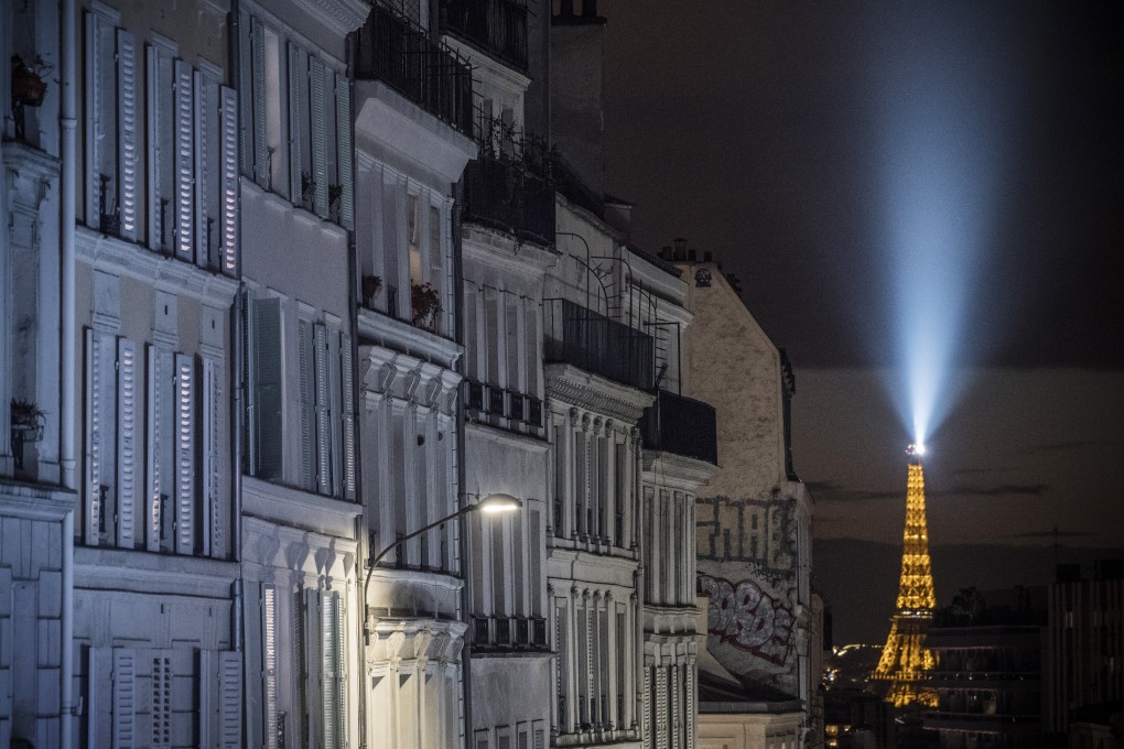 The Eiffel Tower is seen on Friday night during a curfew imposed because of the coronavirus pandemic. Photo: EPA-EFE