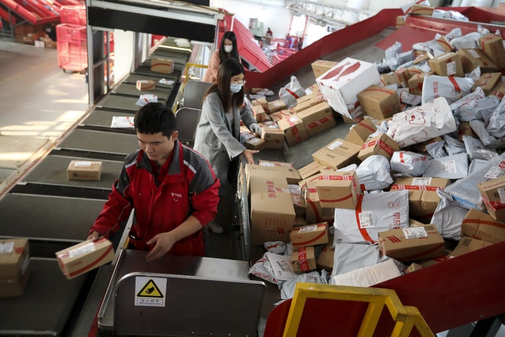 Workers sorting out packages for delivery at JD.com's Yizhuang Smart Delivery Station in Beijing on November 11, 2020. Photo: Simon Song