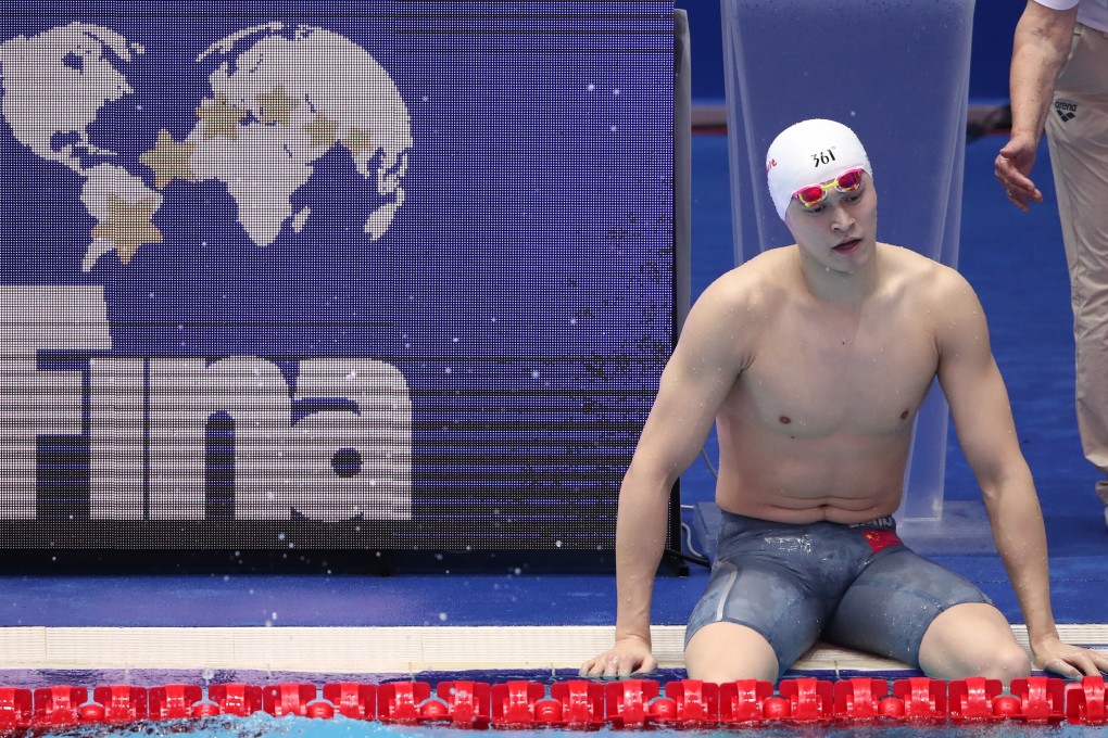 China's Sun Yang sits alone on the edge of the pool after a relay heat at the 2019 Fina world championships in Gwangju, South Korea. Photo: EPA