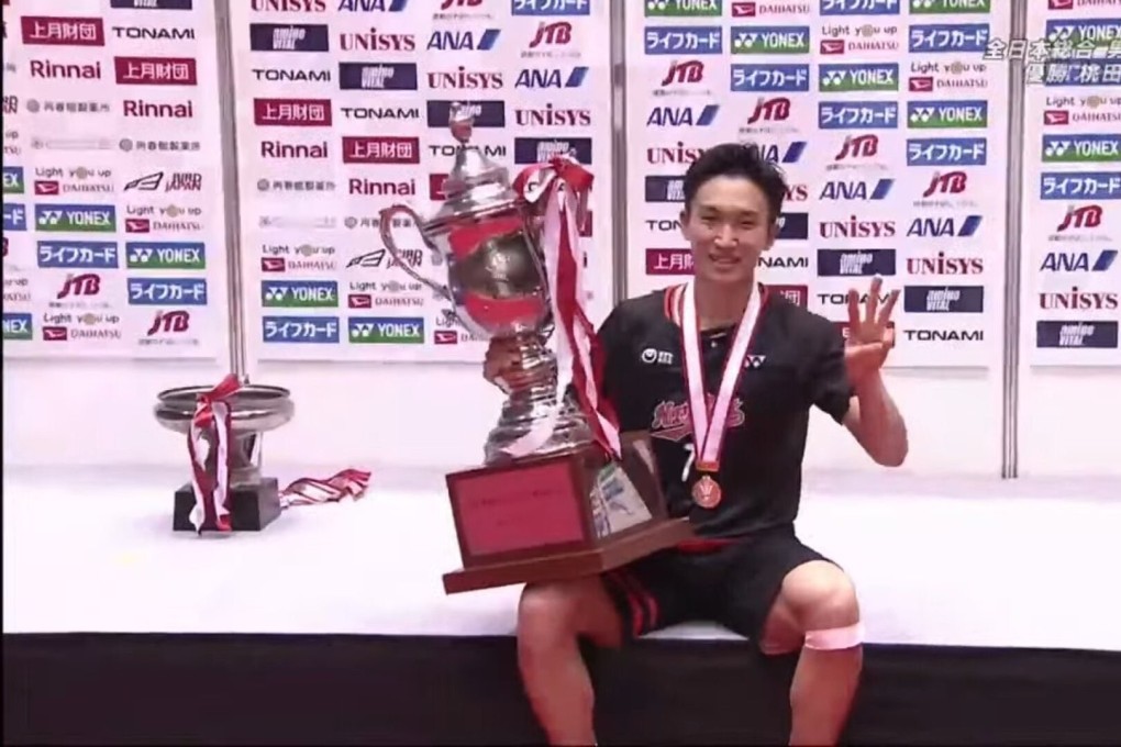 Kento Momota with the trophy after winning the All-Japan National Championships in Tokyo. Photo: Handout