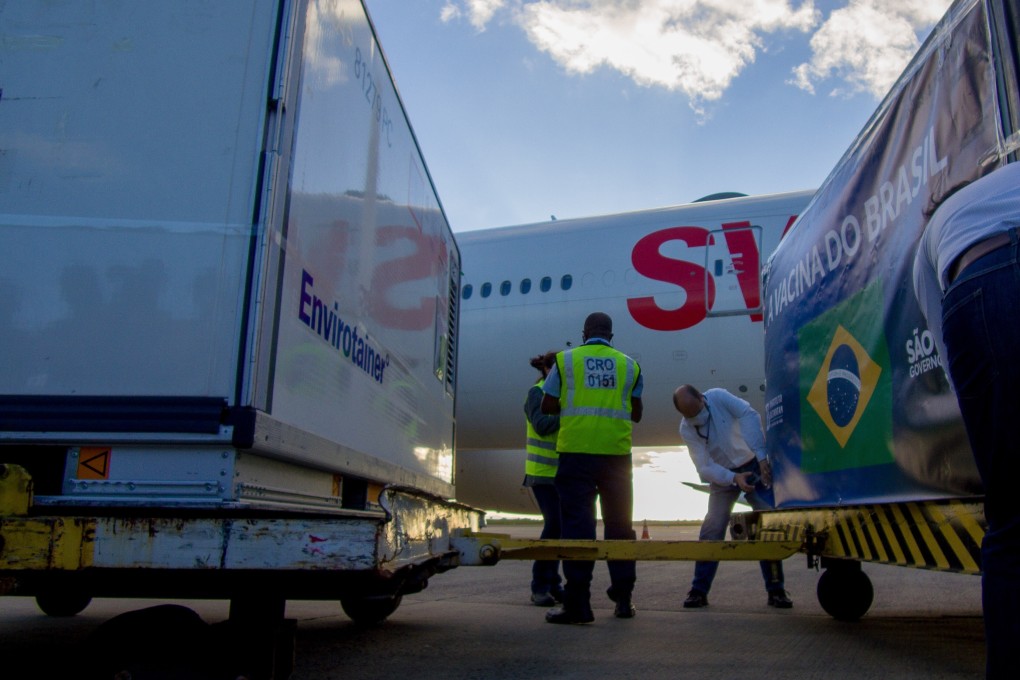 Airport workers in Sao Paulo, Brazil unload a shipment of the Sinovac vaccine. Photo: Zuma/DPA