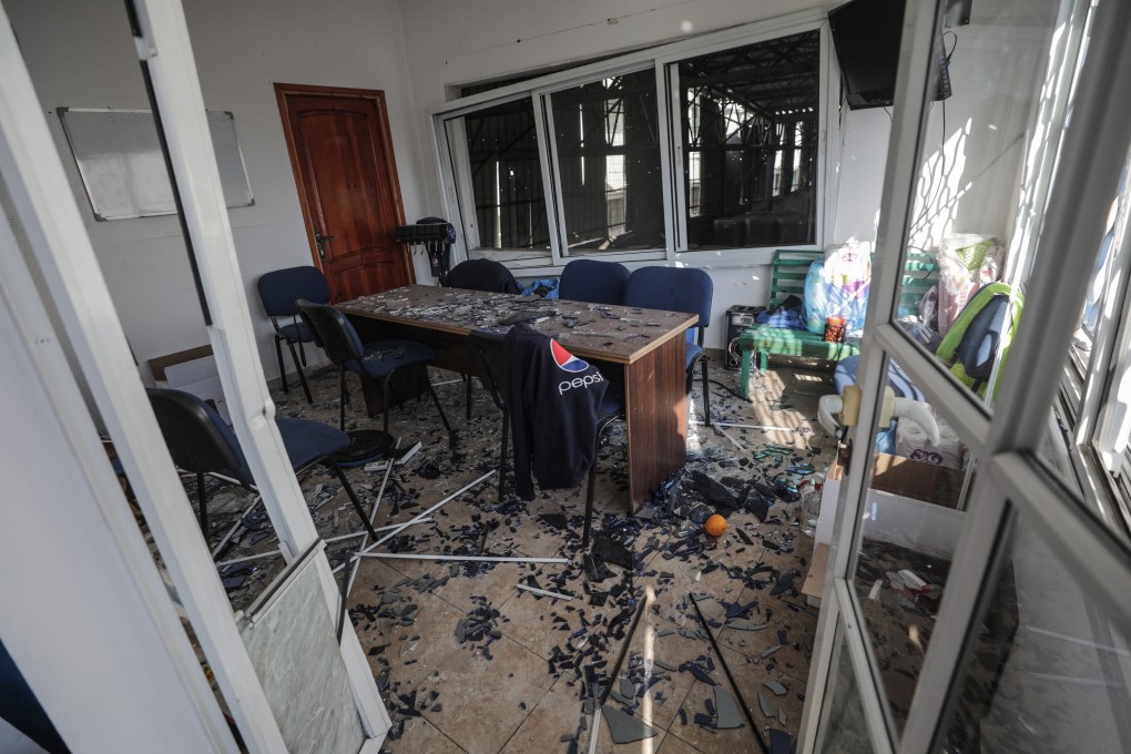 Palestinians inspect a damaged Pepsi factory near a street that Israel reportedly attacked after Palestinian militants fired rockets at Israel, in Gaza City on Saturday. Photo: EPA-EFE